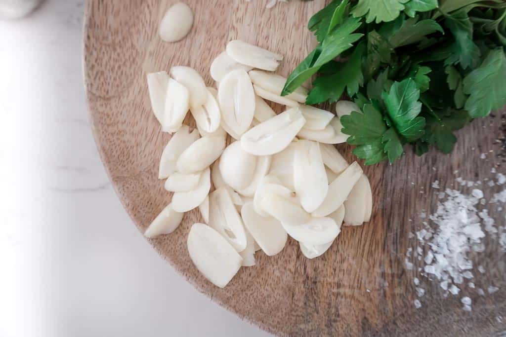 Ingredients to make the pasta from chef the movie. Close up on the sliced garlic