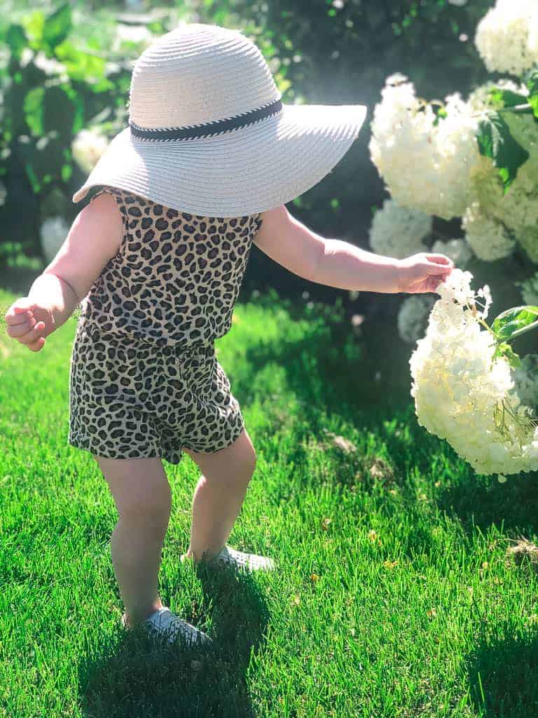Signed Samantha leopard moments - Sloane in a leopard romper and a floppy summer hat.