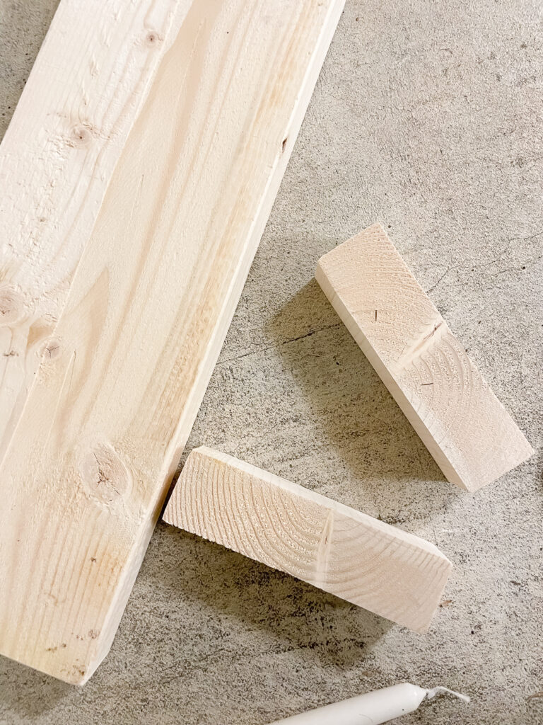 cut wood to make tapered candle holders