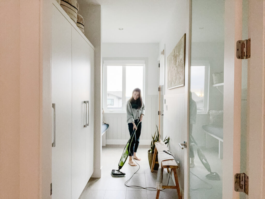 Signed Samantha mopping her mudroom using the thane steam mop