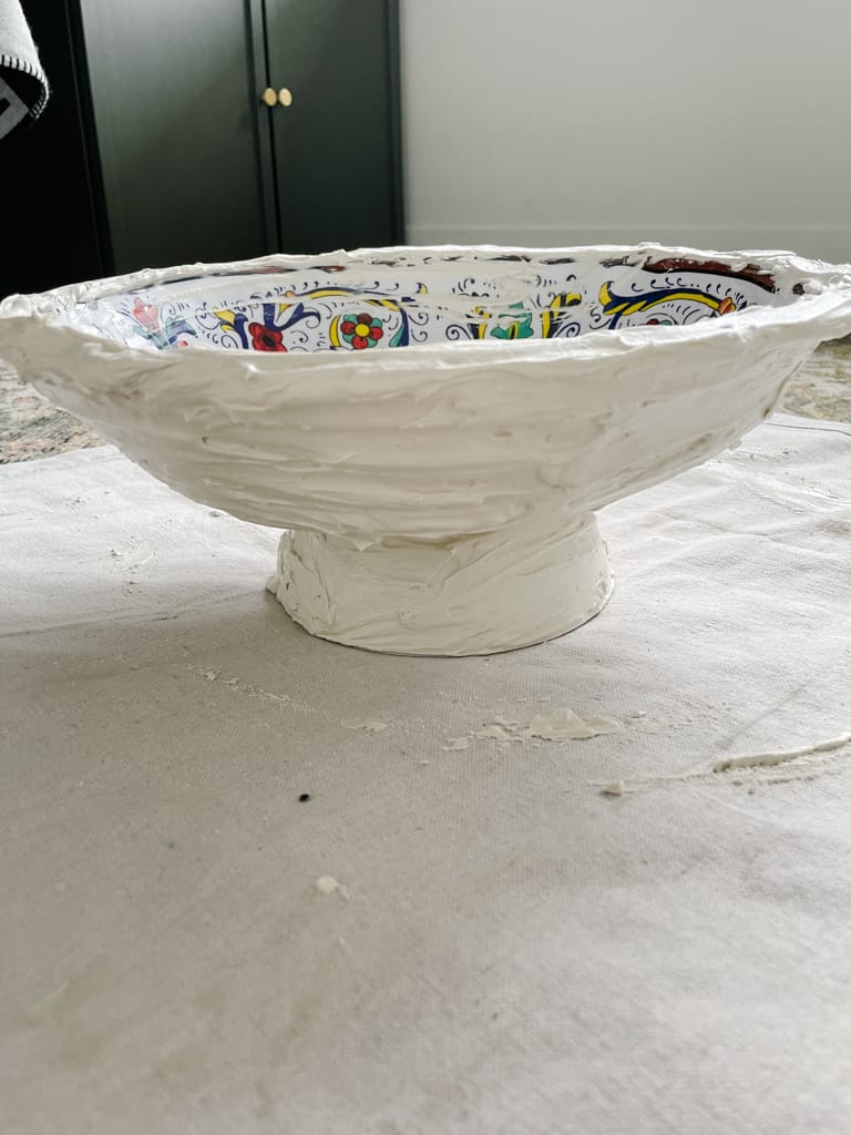 easy pedestal bowl DIY in progress - two bowls glued together bottom to bottom with plaster around it all.