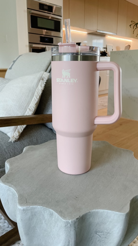 40 oz Stanley Quencher review with the quencher sitting on top of a side table