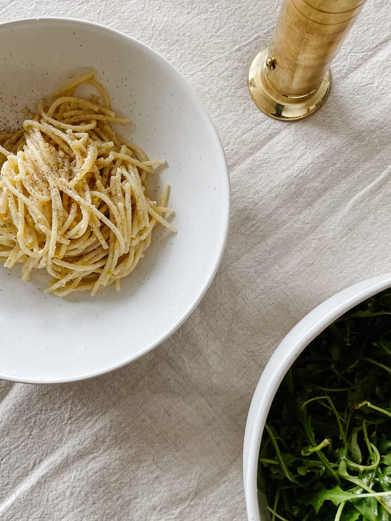 lemon cacio e pepe spaghetti pictured in a bowl