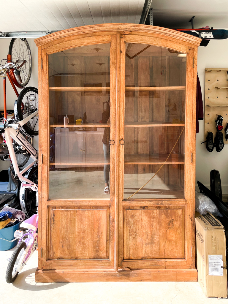 Beautiful arched cabinet that needs to be refinished - glass panels and covered base