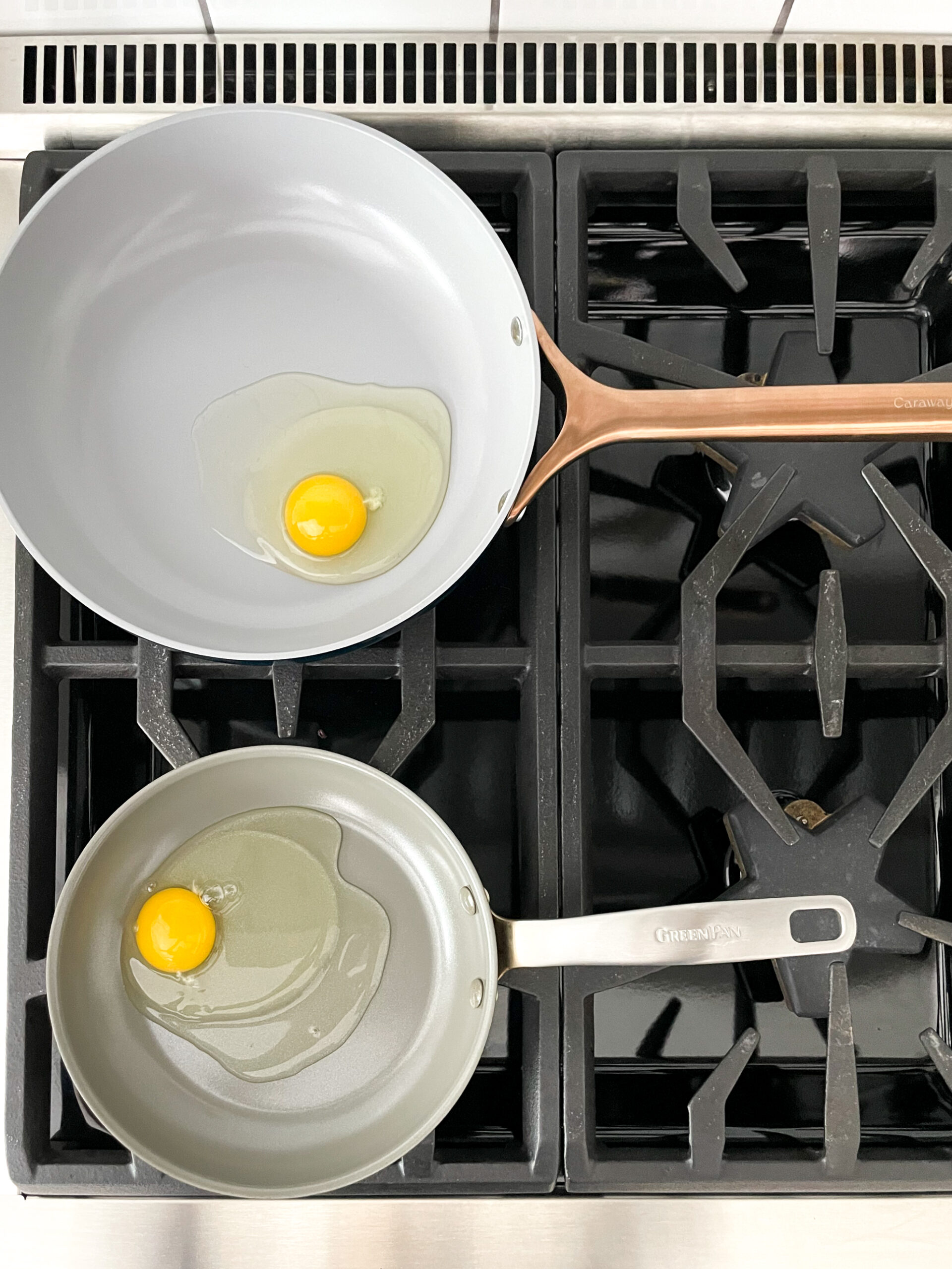 eggs cooking in both caraway and green pan